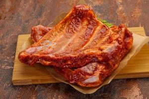 Raw marinated pork ribs photo