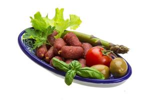 Salami sausages with vegetables photo