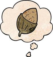 cartoon acorn and thought bubble in grunge texture pattern style vector