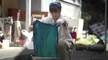 Woman dyeing indigo video