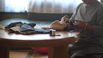 Woman handcrafting a bag video