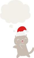 cute cartoon christmas cat and thought bubble in retro style vector