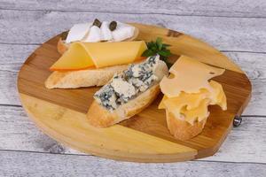 Bruschetta with various cheeses photo