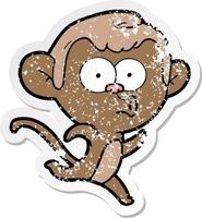 distressed sticker of a cartoon surprised monkey vector