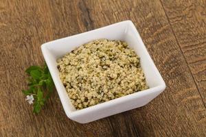 Peeled hemp seeds in the bowl photo