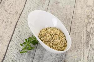 Peeled hemp seeds in the bowl photo