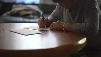 Woman writing a letter video