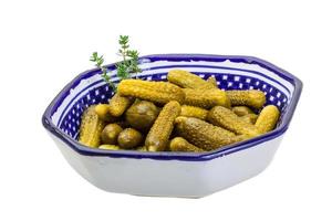 Marinated cucumbers, pickles in a bowl photo