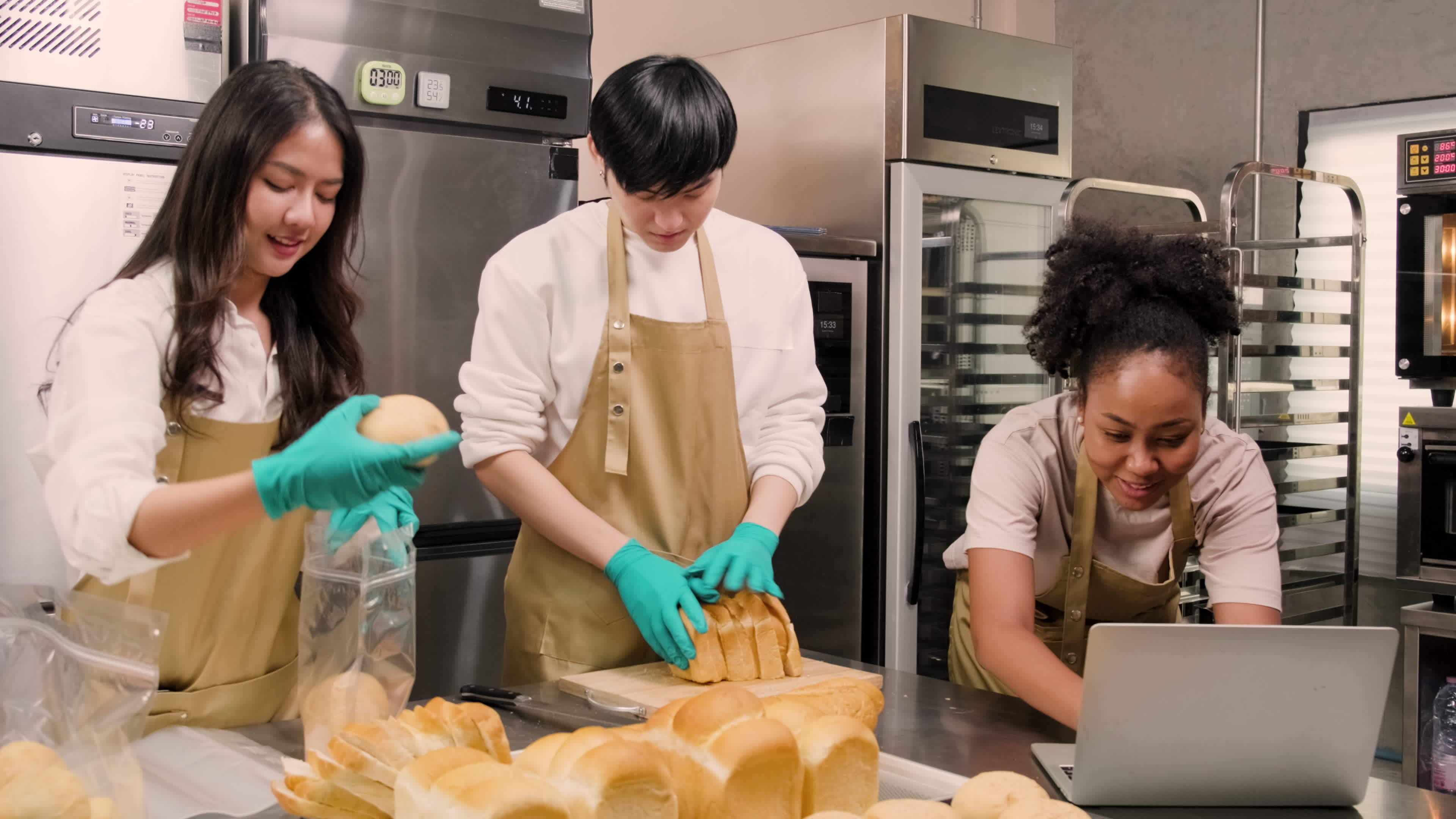 Three young friends and startup partners of bread dough and pastry