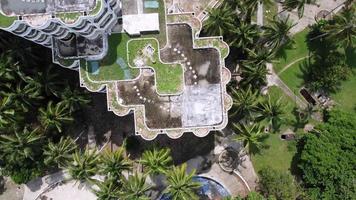 Aerial top down view dilapidated hotel building video