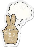 cartoon rabbit and thought bubble as a distressed worn sticker vector