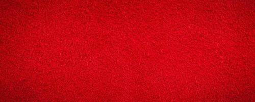 Red suede genuine leather background. Velvet red background close-up photo. photo