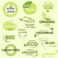 A set of logos for goods in green. Goods for a healthy diet. Handmade. Organics. Bio. Vector stock illustration