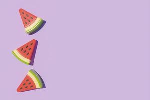 Slice of watermelon isolate on purple background, Summer time concept, 3d rendering. photo