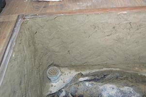 Concreting brick walls of the cellar photo