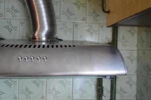 Installing a kitchen hood for ventilation photo