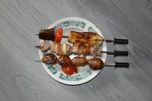 Meat kebab, vegetables and potatoes photo