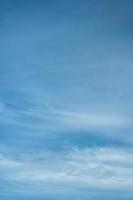 Light cloudy blue sky vertical background. photo