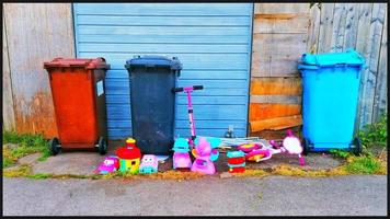 Toys thrown out with the rubbish. Hull, UK photo