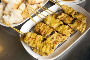 Pork satay with sauce photo