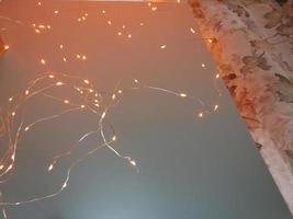 Christmas lights isolated on a plain light background. Christmas glowing garlands photo