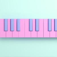 Pink piano keyboard on bright background in pastel colors photo