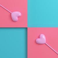 Two pink hearts on a stick on bright red blue background in pastel colors photo