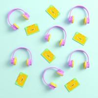 Headphones and retro cassette tapes on bright background photo