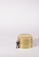 Business man figure standing in front of  bitcoin. Bitcoin mining concept. photo