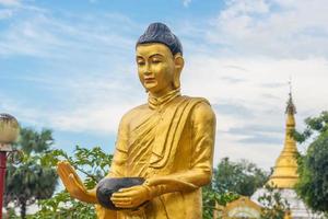 The Buddha statue in Burma style in Bago town of Myanmar. Buddha statues are the representations of Lord Buddha himself. photo