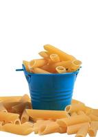 raw macaroni in blue bucket on white background photo