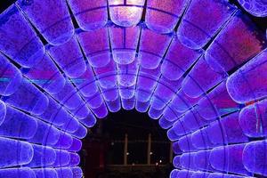 New Year and Christmas decorations on the street in the form of a neon tunnel. Copy space. photo