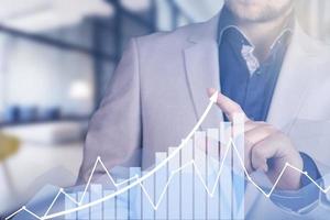 Development and growth concept. Businessman plan growth and increase of positive indicators in his business. photo