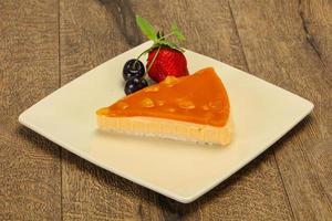 Cheesecake with apricot served strawberry photo