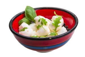 Mozzarella with herbs in the bowl photo