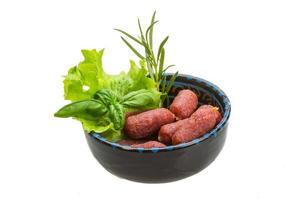 Salami sausages in the bowl photo