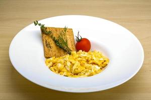 Scrambled eggs with tomato photo