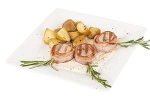 Grilled steak wrapped in bacon, with grilled vegetables, mashed potatoes photo