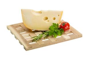 Maasdam cheese on board  isolated on white background photo