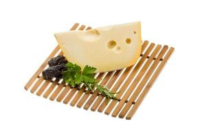 Maasdam cheese on board  isolated on white background photo