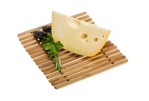 Maasdam cheese on board  isolated on white background photo