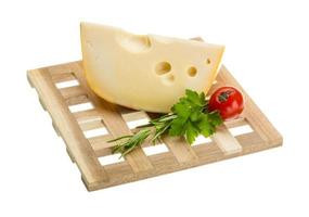 Maasdam cheese on board  isolated on white background photo