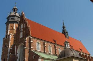 Cracow - Corpus Christi Church was founded by Kasimirus III The Great about 1340. The front elevation has a gothic gable whilst decoration of the interior is baroque photo