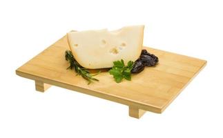 Maasdam cheese on wooden plate photo