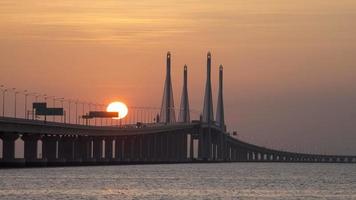 Timelapse egg yolk sunrise at Penang Second Bridge video