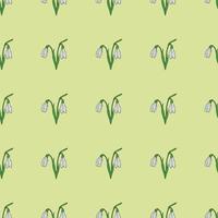 Seamless background of drawing snowdrops on a bright green background. Endless pattern with flower for your design. vector