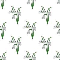 Seamless background with lovely snowdrops on white background. Endless vector flowers pattern for your design.