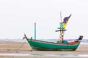 Fishing boat on the beach photo