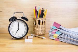 7 AM Clock on work desk in the office Time of business working concepts selective clock photo