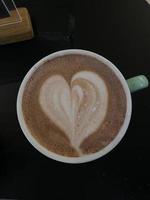 A good coffee in the shape of a heart photo